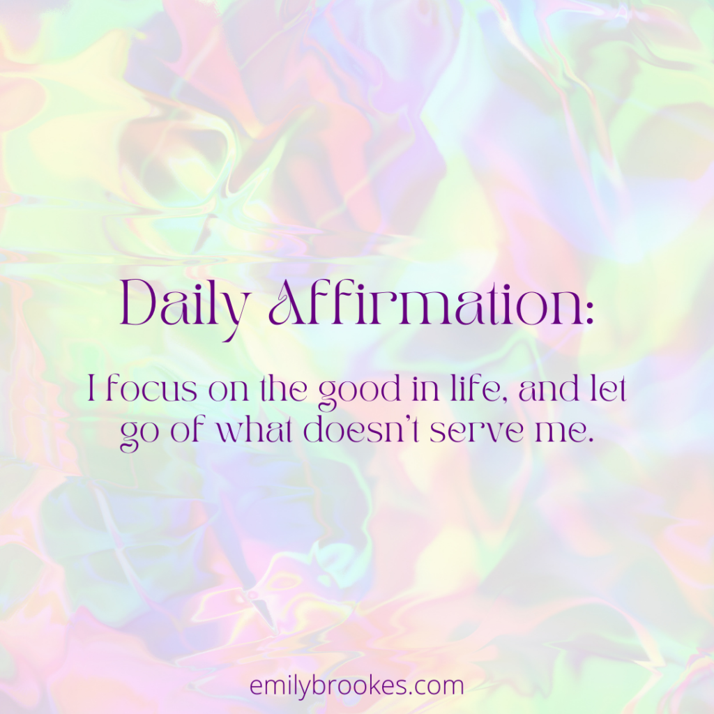 Text reads: Daily affirmations - I focus on the good in life and let go of what doesn't serve me' on an iridescent rainbow background.